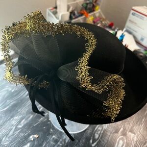 Black hat with black and gold adornment